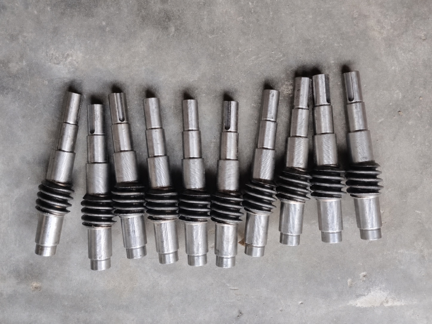 Machined shafts and drive components for carding machinery