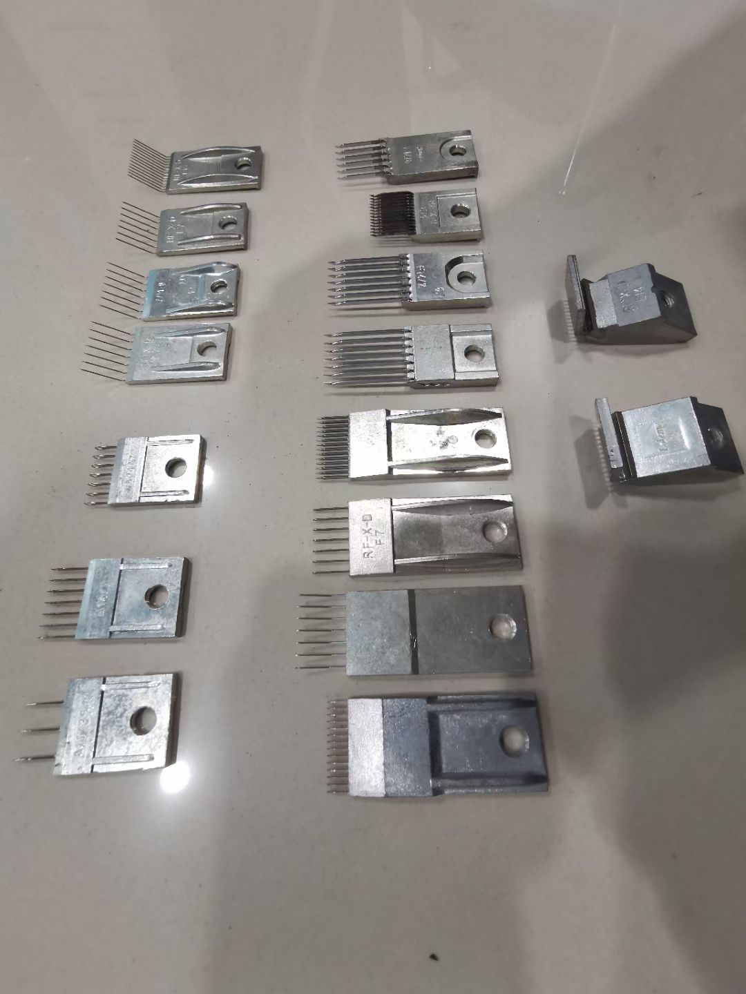 Warp knitting needle blocks in different gauges and configurations
